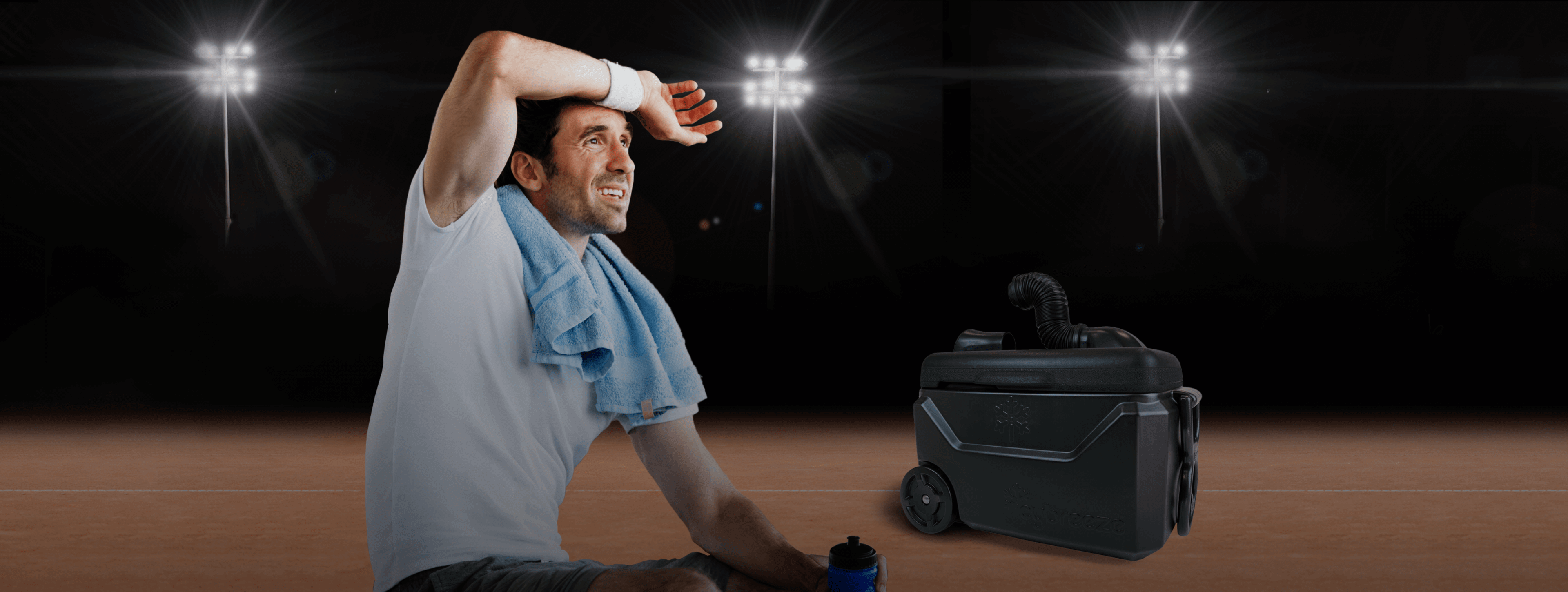 Athlete resting next to a cooler 